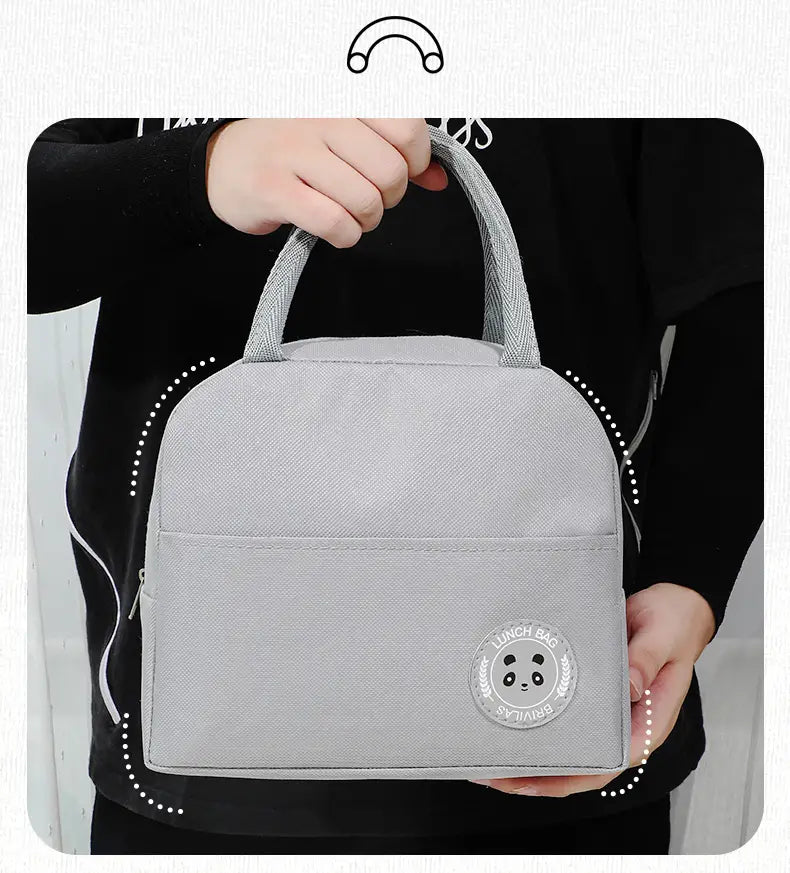 Someone is holding the insulated lunch bag by the handle.