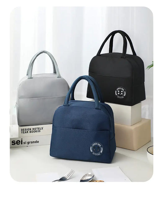 Three insulated lunch bags with handles. Black, Grey and Blue.